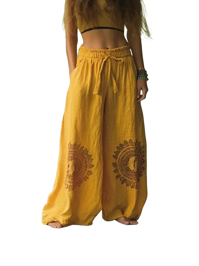 Yellow vintage casual wide leg pants with earthy brown circular embroidery on the lower legs in casual pants style