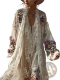 A flowing off-white lace kimono-style dress with floral embroidery and beaded detailing in soft purple and green hues