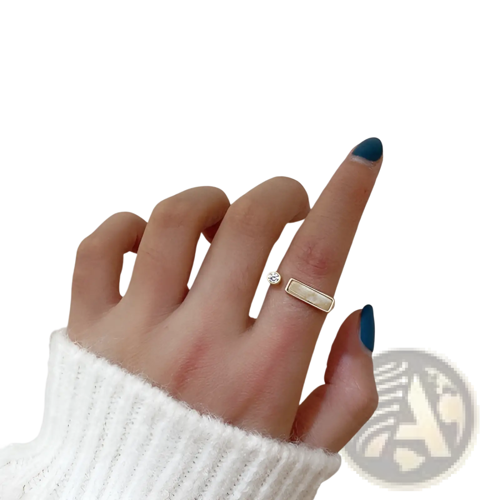 A delicate gold-toned adjustable ring featuring a small round zircon and a rectangular textured marble stone accent