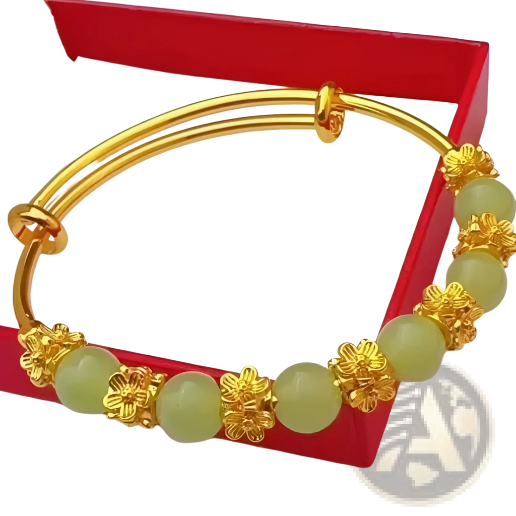 Vintage gold plated chalcedony flower bangle bracelet with gold-toned metal and light green jade beads separated by floral accents