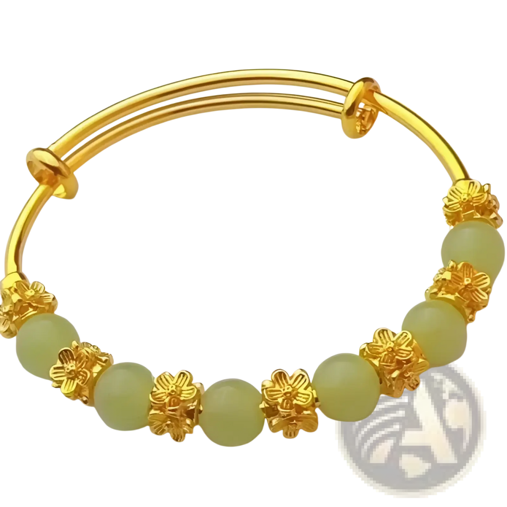 Vintage gold plated chalcedony flower bangle bracelet with gold-toned band and pale green jade beads and floral charms