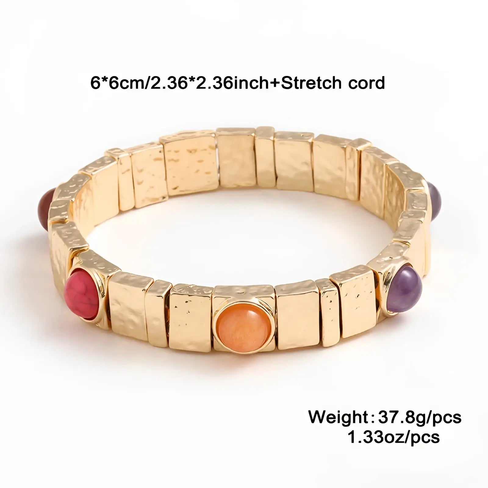 Vintage hammered gold bangle featuring rectangular stretch segments with red orange and purple gemstone accents
