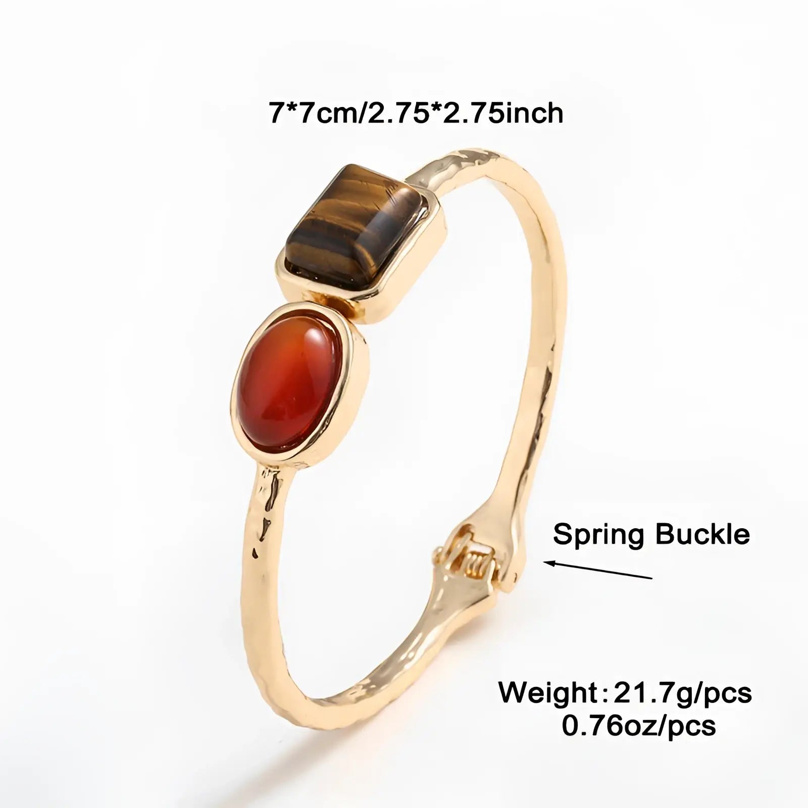 Vintage hammered gold bangle featuring a textured spring buckle with tiger’s eye and carnelian gemstone accents