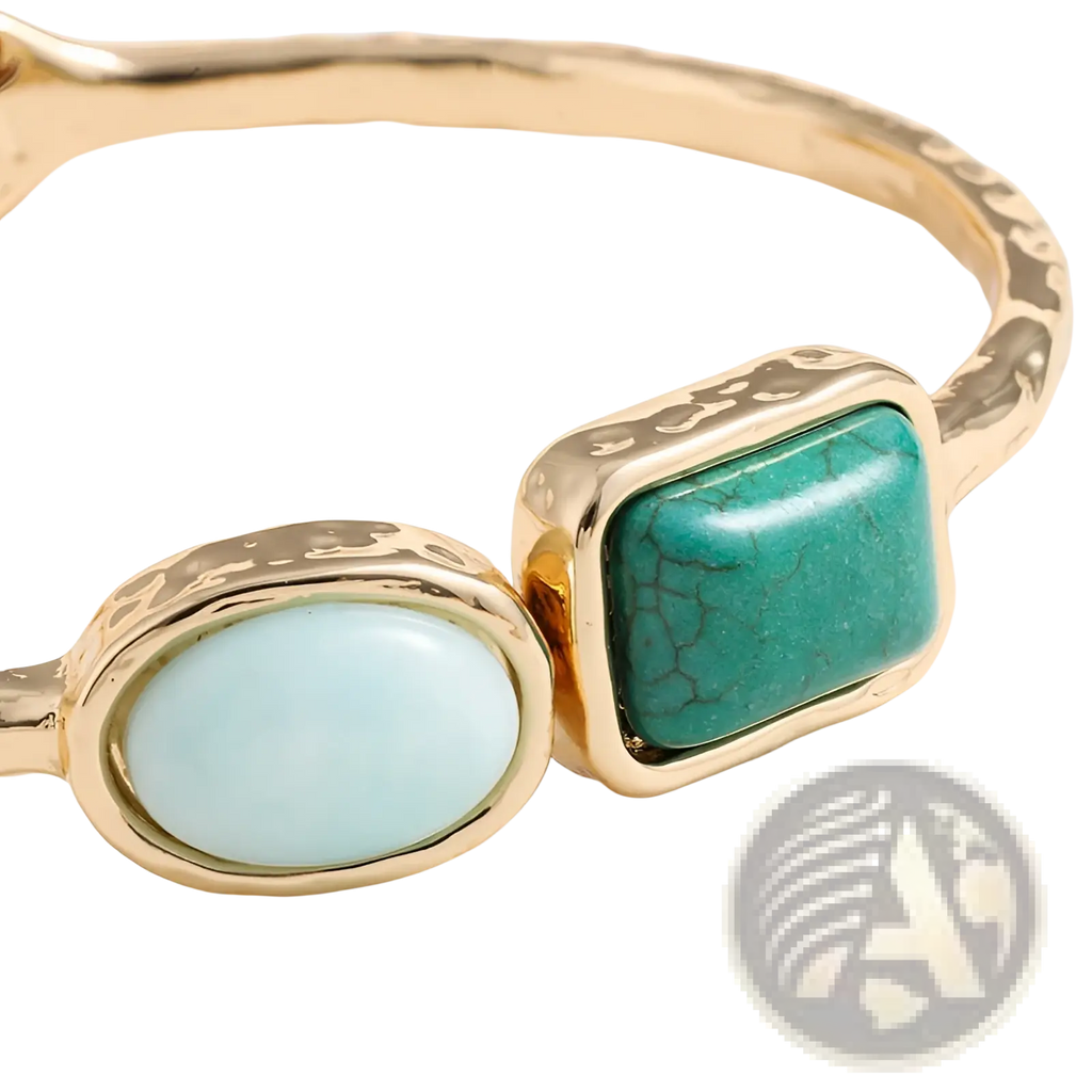 Vintage hammered gold bangle featuring a light blue oval stone and a teal rectangular turquoise with crackle patterns