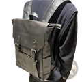 Dark gray leather vintage college backpack with silver metal buckles and front flap closure large capacity travel bag