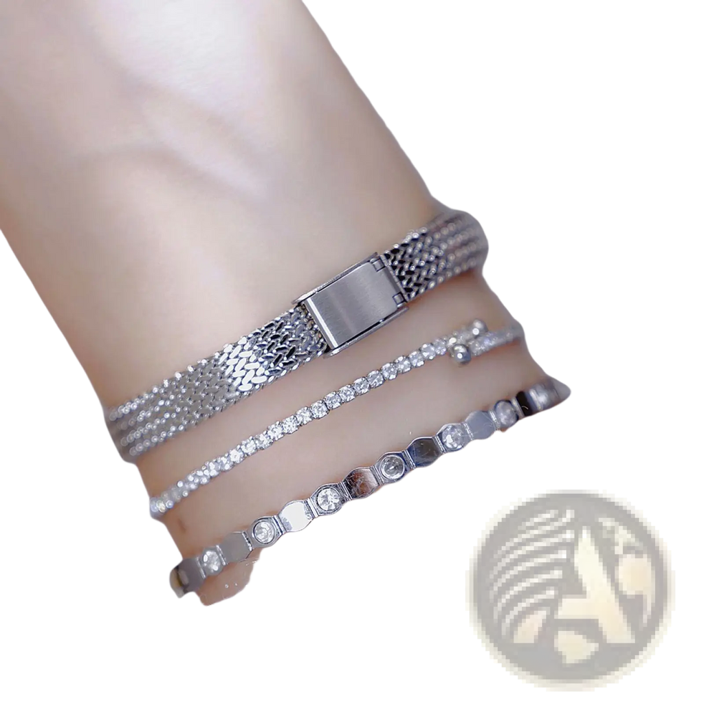 Vintage mesh bracelet watch with silver mesh band and rectangular clasp adorned with small sparkling diamond accents