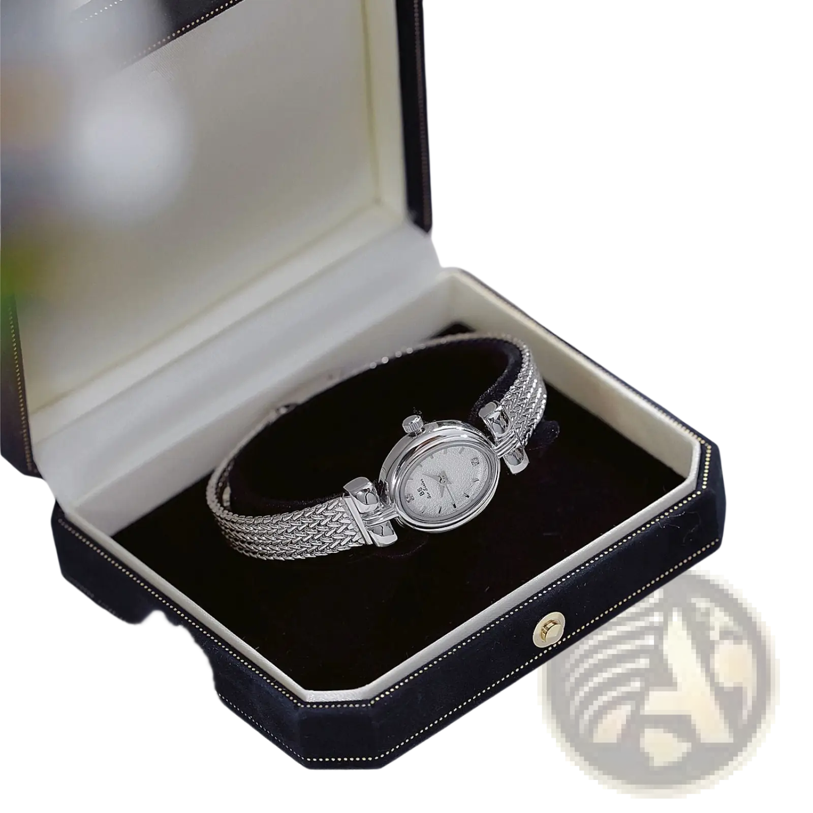 Silver-toned vintage mesh bracelet watch with diamond accents and braided band in an elegant black velvet box