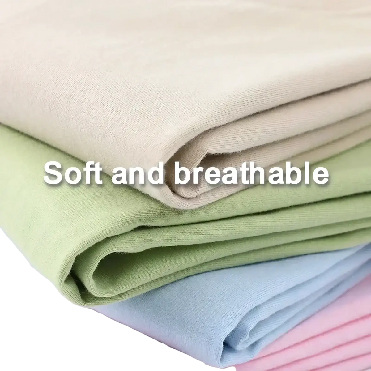 Stack of soft breathable cotton fabrics in beige light green pale blue and pink for vintage muscle car graphic t shirt
