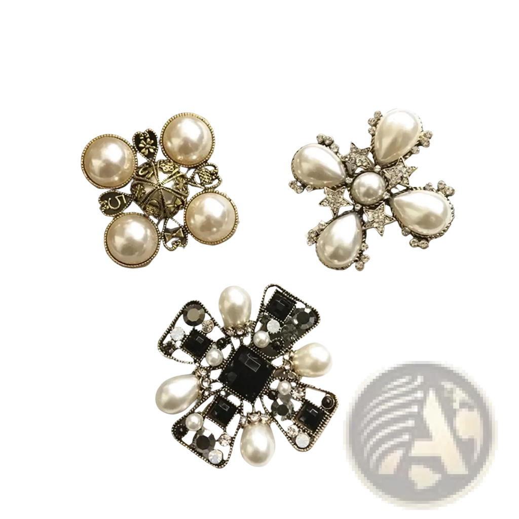 Three vintage pearl rhinestone designer brooches with gold-toned metal frames featuring pearl and crystal embellishments