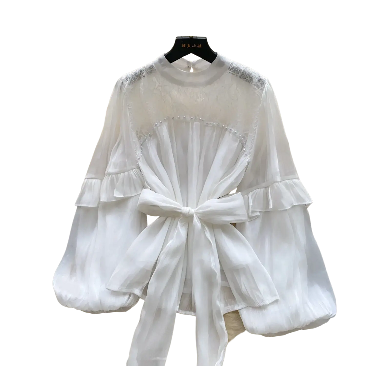 White sheer vintage puff sleeve blouse with ruffled sleeves and tied waistband for y2k streetwear style