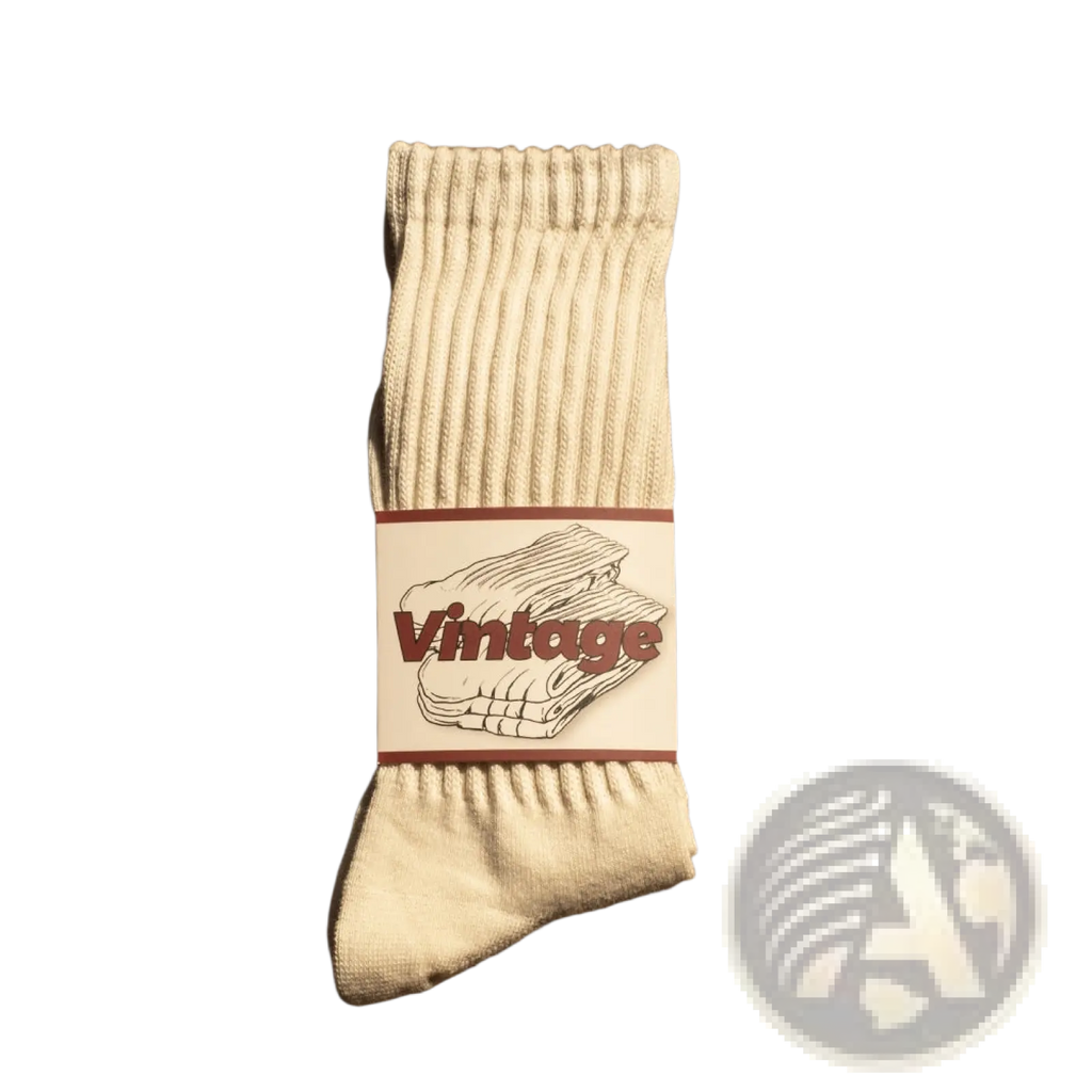 Cream-colored vintage ribbed cotton long socks for men with a white label featuring maroon lettering and folded socks illustration