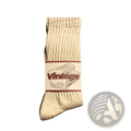 Cream-colored vintage ribbed cotton long socks for men with a white label featuring maroon lettering and folded socks illustration