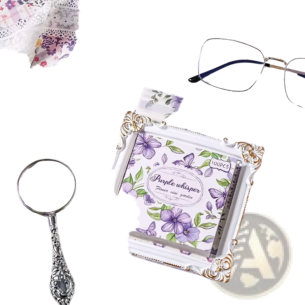 A decorative white picture frame with gold ornate detailing featuring a purple whisper floral design vintage scrapbooking paper