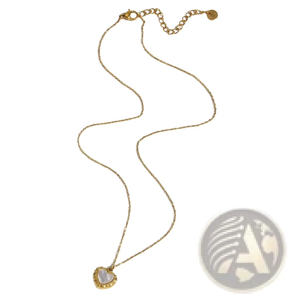 Vintage shell heart pendant 18k gold plated necklace with a white lustrous stone set in an ornate gold frame