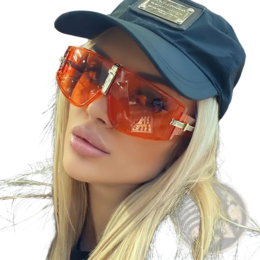 Vintage shield uv400 futuristic oversized sunglasses with orange translucent lenses and metallic gold-tone frames