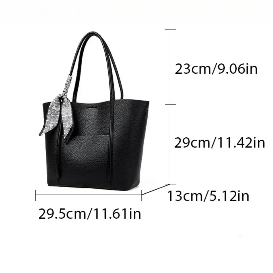 Black textured leather vintage shoulder bag large soft tote with silver patterned ribbon tied on one handle