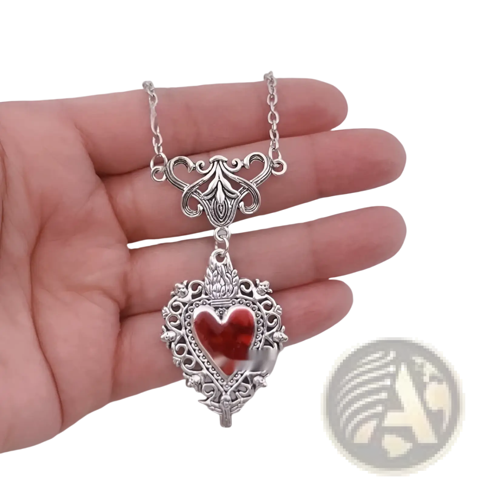 Vintage silver filigree heart pendant necklace with a vibrant red glass center for elegant wear
