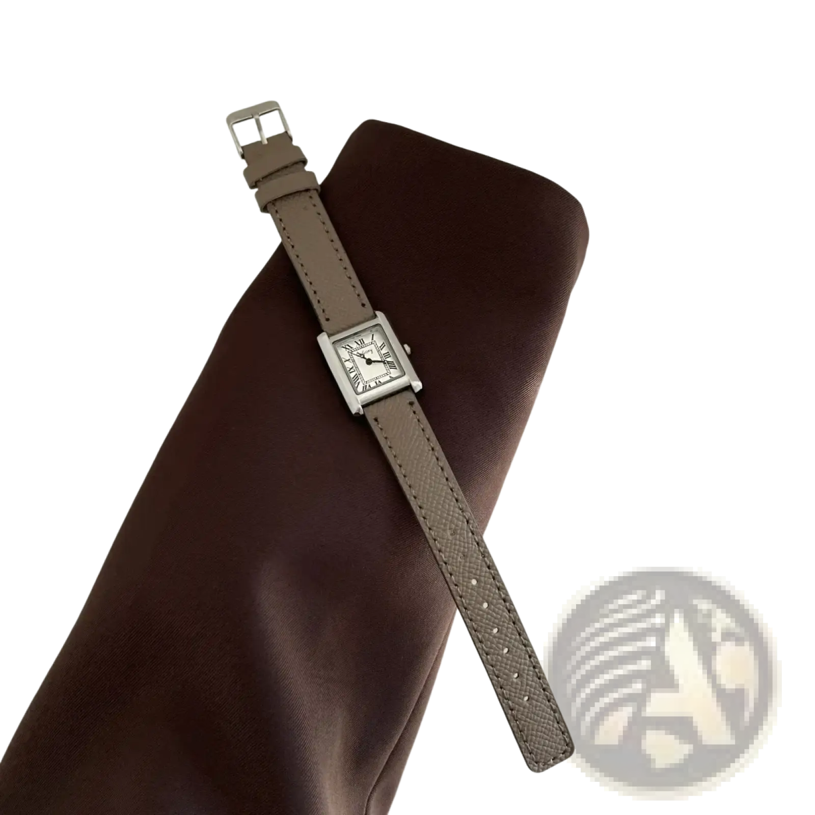 A vintage square quartz watch for women with a silver-toned minimalist face and taupe leather strap
