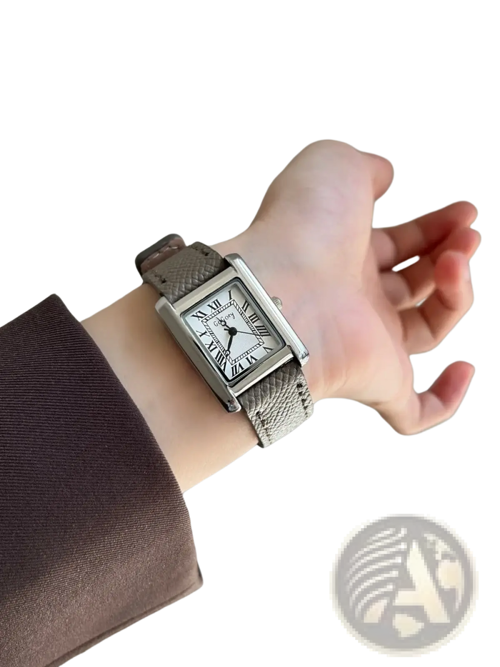 A vintage square quartz watch for women with a sleek silver-toned case white face roman numerals and taupe leather strap