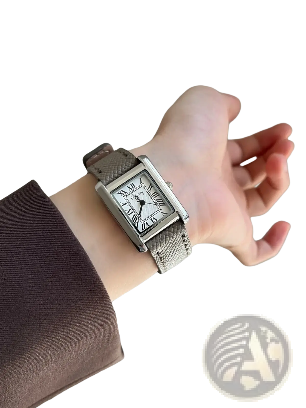 A vintage square quartz watch for women with a sleek silver-toned case white face roman numerals and taupe leather strap