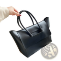 Black leather vintage structured tote bag with minimalist design and dual top handles for everyday use