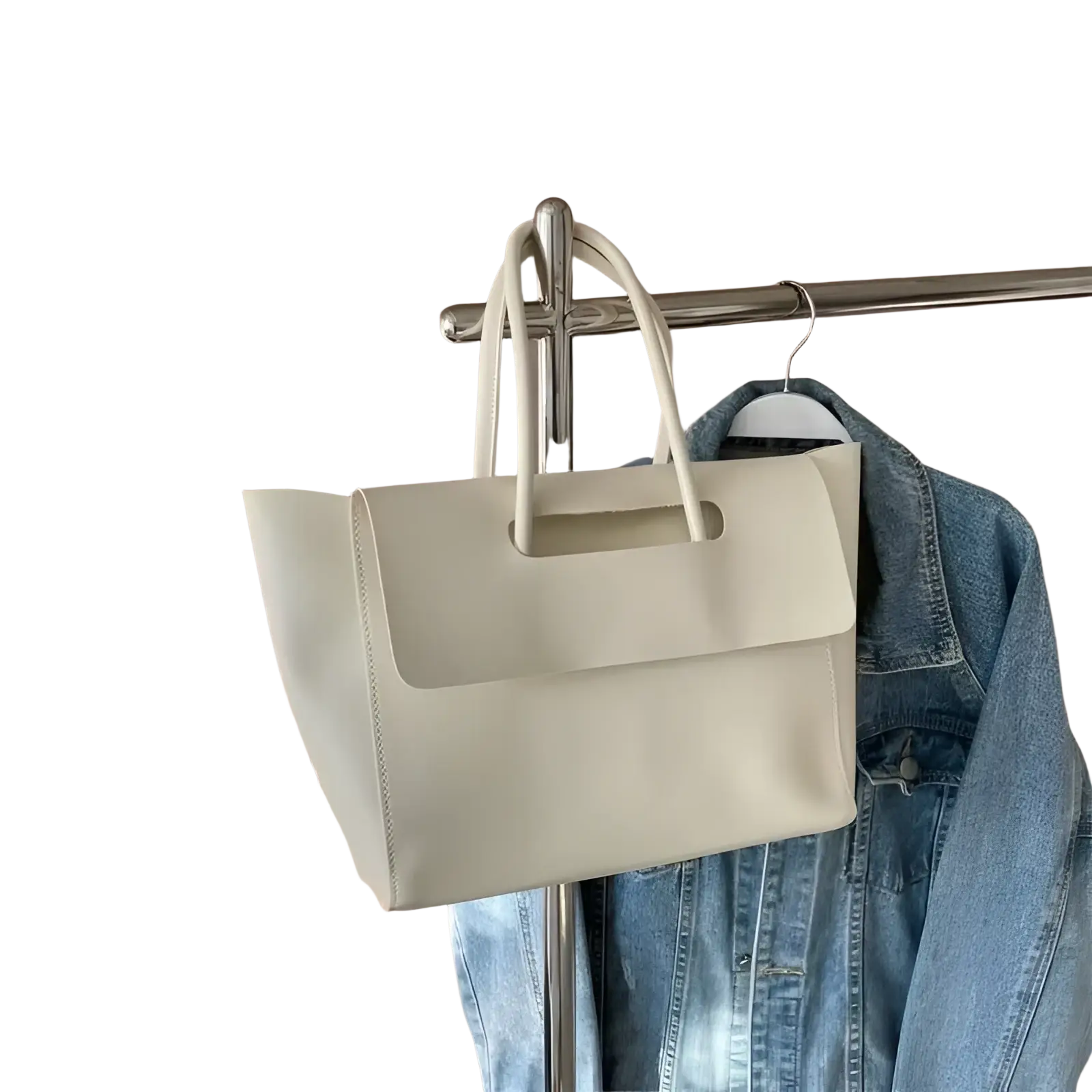 Cream-colored vintage structured leather tote bag with matching top handles and minimalist design for daily use