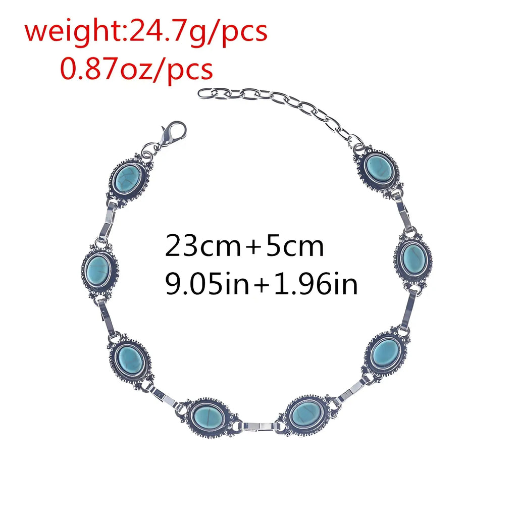 Vintage turquoise silver ornate boho anklet featuring seven oval turquoise stones set in darkened metal links