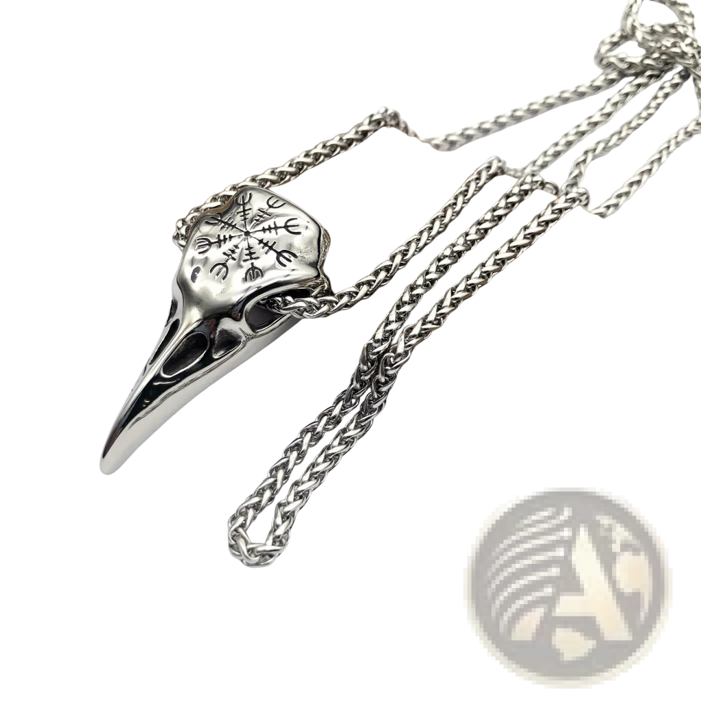 Silver vintage viking runic raven skull pendant with intricate engravings on a braided stainless steel chain
