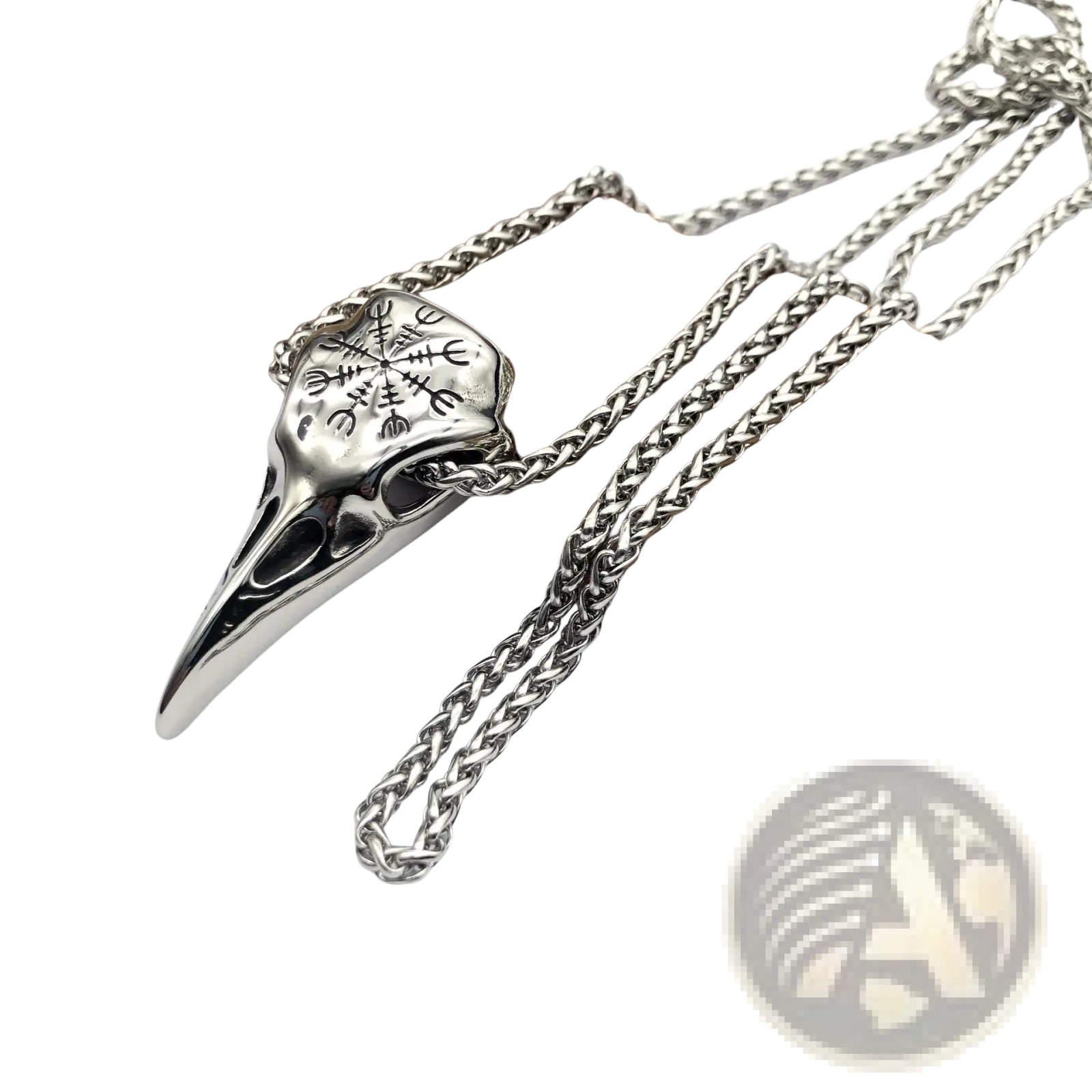 Silver vintage viking runic raven skull pendant with intricate engravings on a braided stainless steel chain