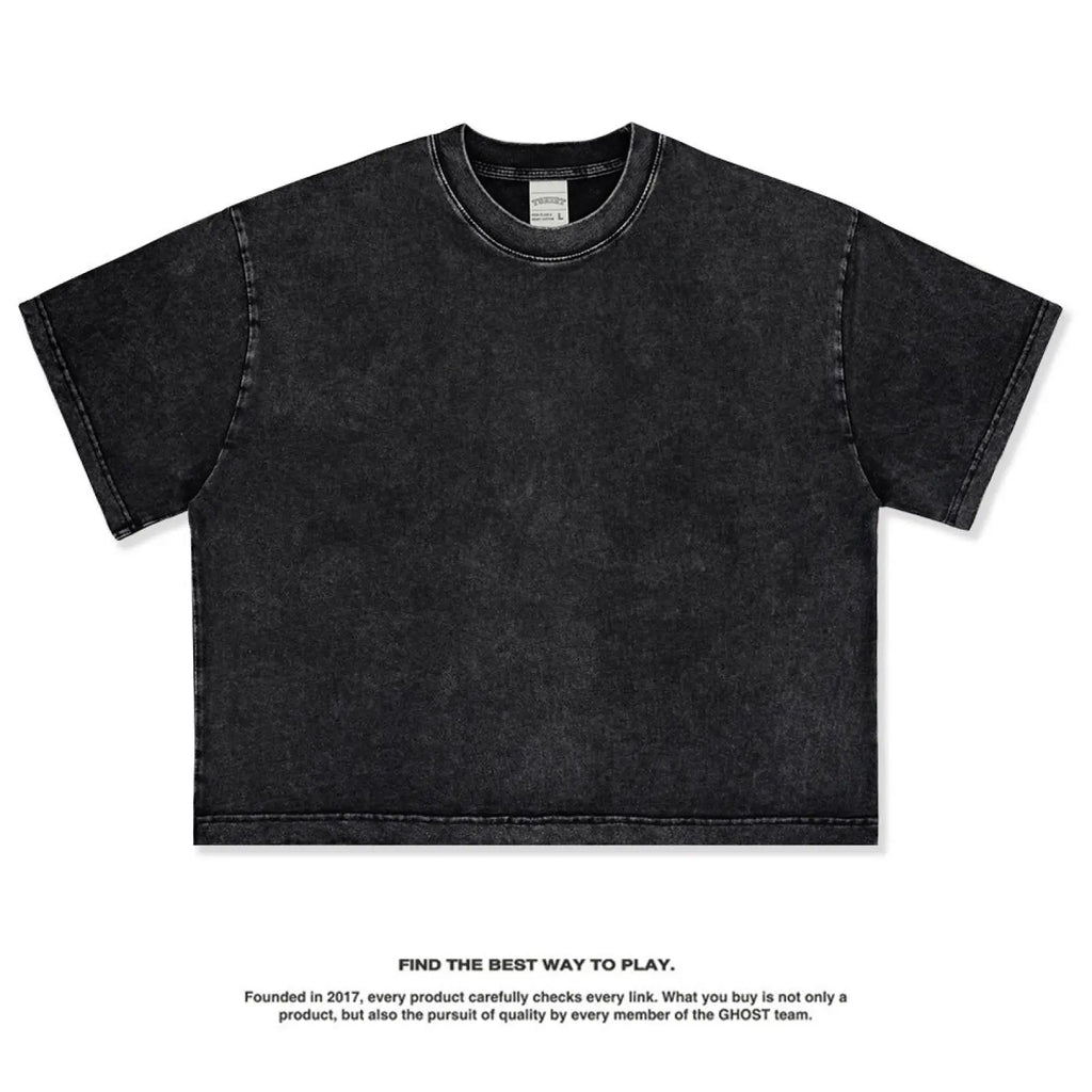 Black distressed vintage washed cropped cotton t-shirt with a relaxed fit and short sleeves