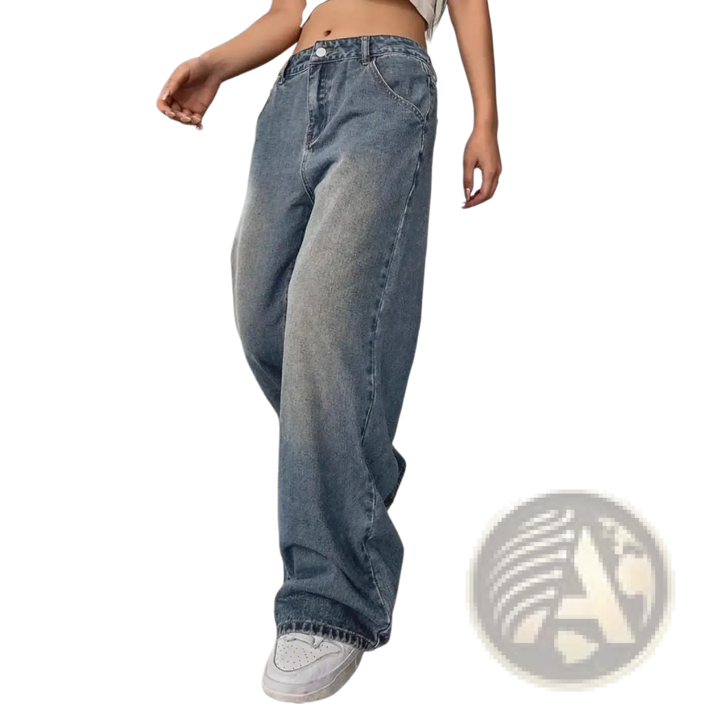 Vintage washed wide leg denim jeans in faded blue with subtle distressing on the thighs made from denim fabric
