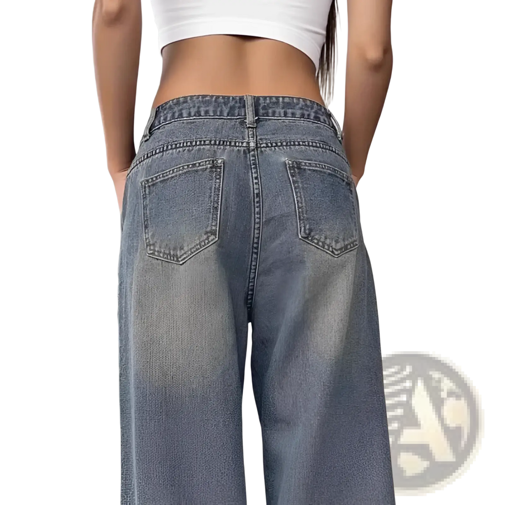 Vintage washed wide leg denim jeans in light wash with high waist and classic back pockets shown from the back side
