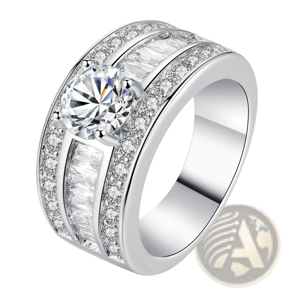 A wide silver vintage zircon heart arrow adjustable ring with a central round-cut diamond and baguette diamonds