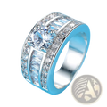A wide silver vintage zircon heart arrow adjustable ring with a central round-cut gemstone and baguette stones