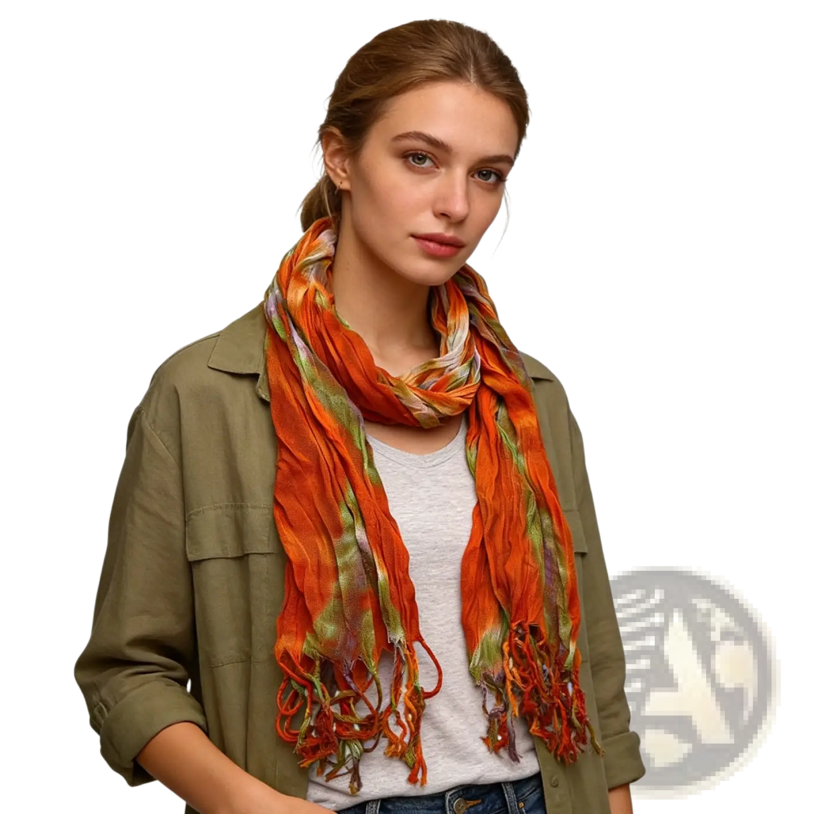 A vibrant orange and green lightweight viscose scarf with tie dye print and frayed edges worn loosely around the neck