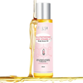 A pink-labeled bottle of alke glutathione and vitamin c essential oil with silver cap containing golden-yellow serum for smooth skin care
