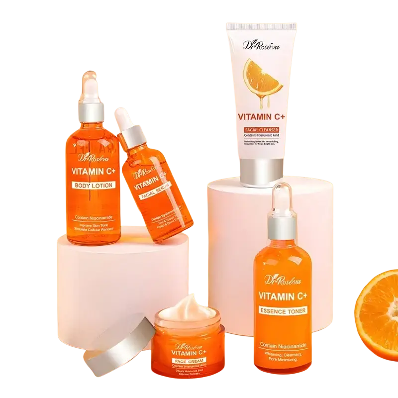 Orange-tinted glass vitamin c brightening skincare bottles with silver dropper caps and white dr labels