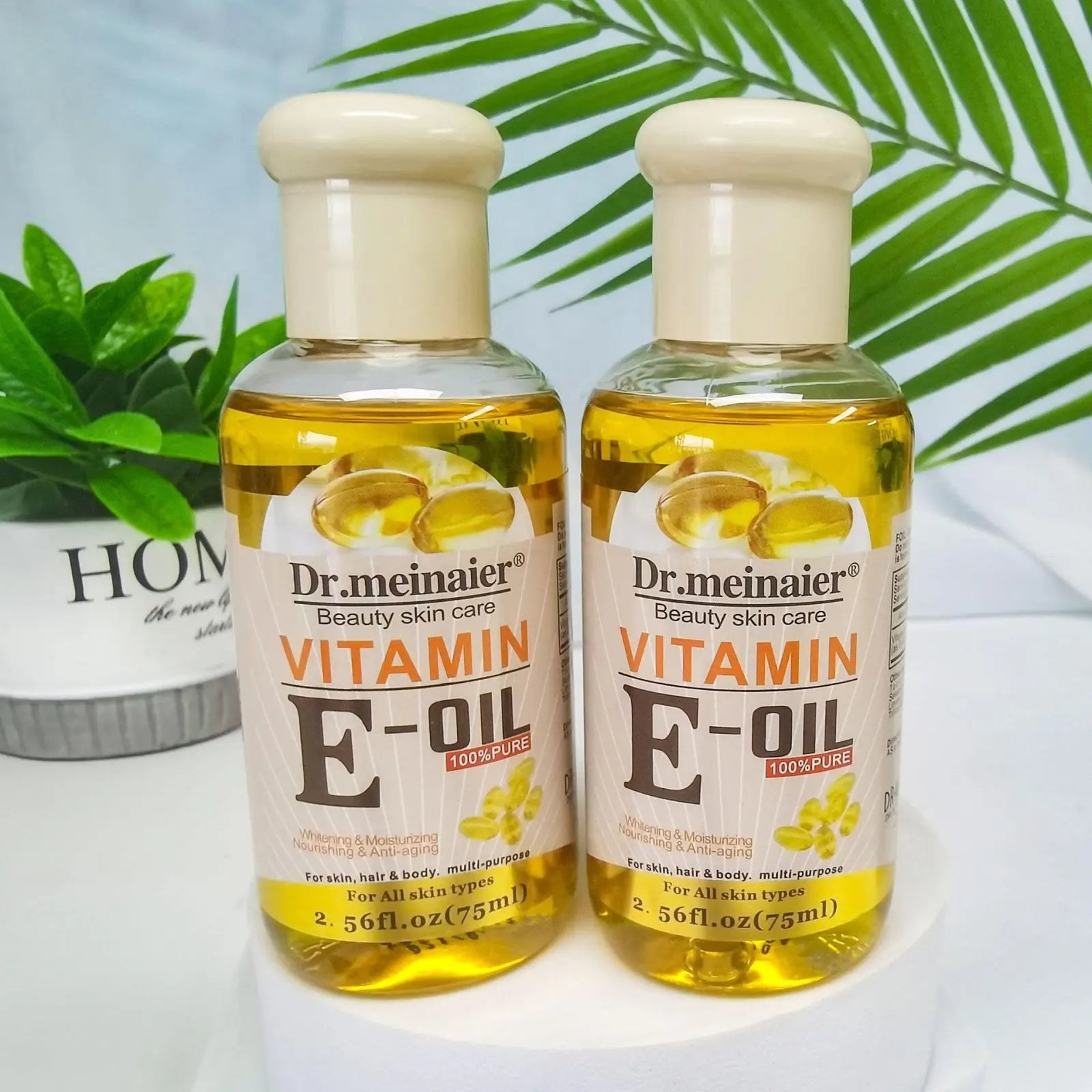 Two transparent bottles of Dr. in vitamin E synthesis oil for face body and hair 75ml shown from the front side