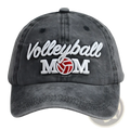 Dark gray distressed denim baseball cap with embroidered white cursive volleyball and red and white volleyball mom graphic
