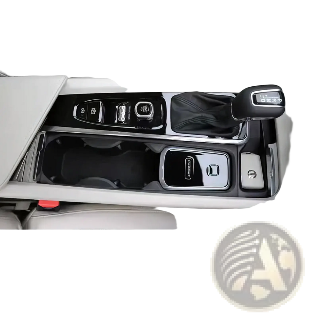 Black and silver glossy center console trim with integrated cup holders gear shift knob and button controls for volvo cleanzone wireless car charger and air purifier