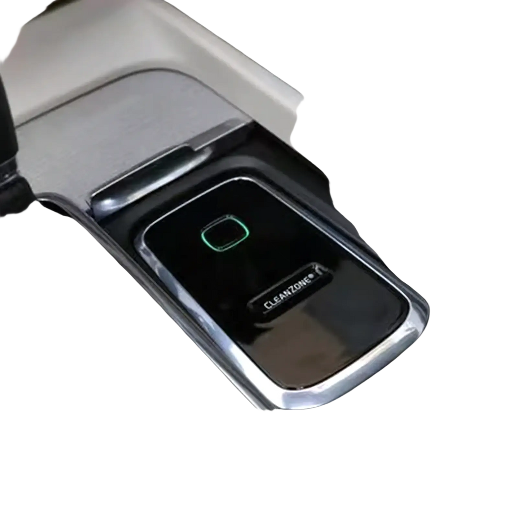 Black rectangular Volvo Cleanzone wireless car charger and air purifier with chrome trim and glowing green indicator