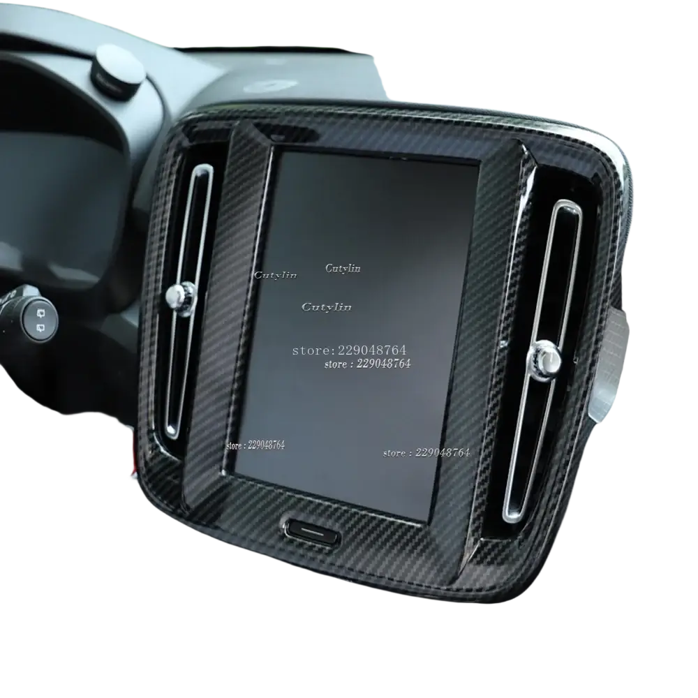 Volvo xc40 carbon fiber interior trim kit 2019-2021 with black carbon fiber texture and silver accents around infotainment screen