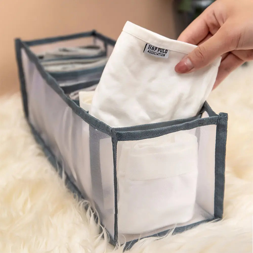 transparent mesh underwear organizer with gray fabric trim holding white underwear designed as a 7grid and 11grid drawer storage box for efficient clothing organization