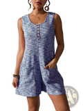A sleeveless blue and white waffle knit button front jumpsuit with round neckline and side pockets