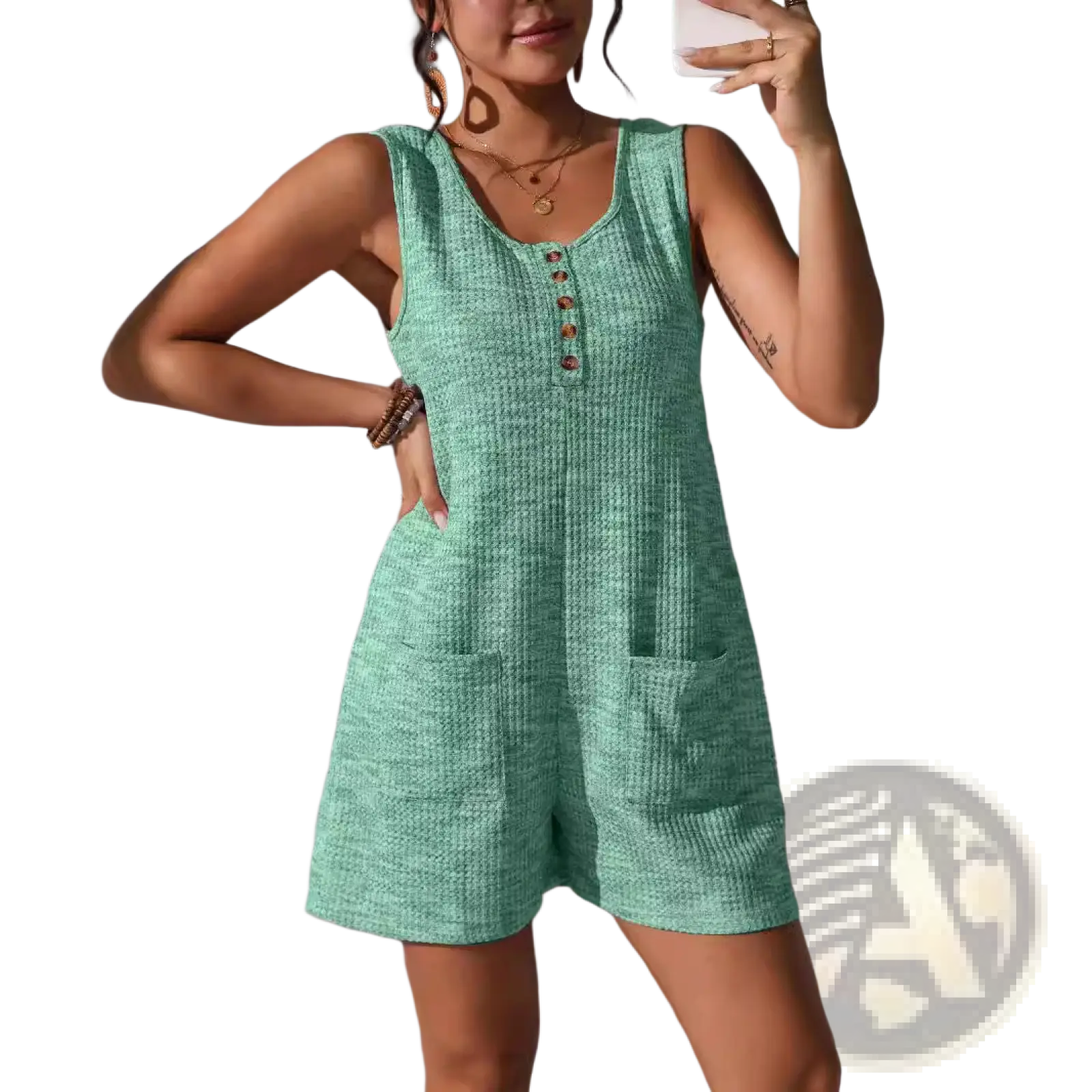 A mint green waffle knit sleeveless romper with button front neckline and two front pockets