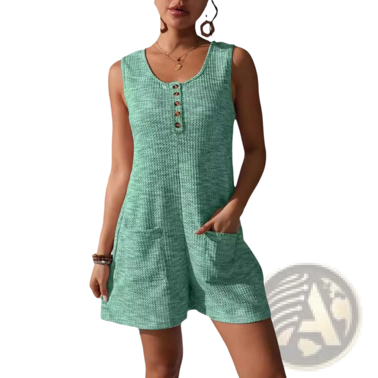A sleeveless mint green waffle knit button front jumpsuit with textured fabric and side pockets