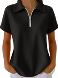 Black waffle knit half zip short sleeve polo shirt with ribbed texture and white zipper pull and collar detail