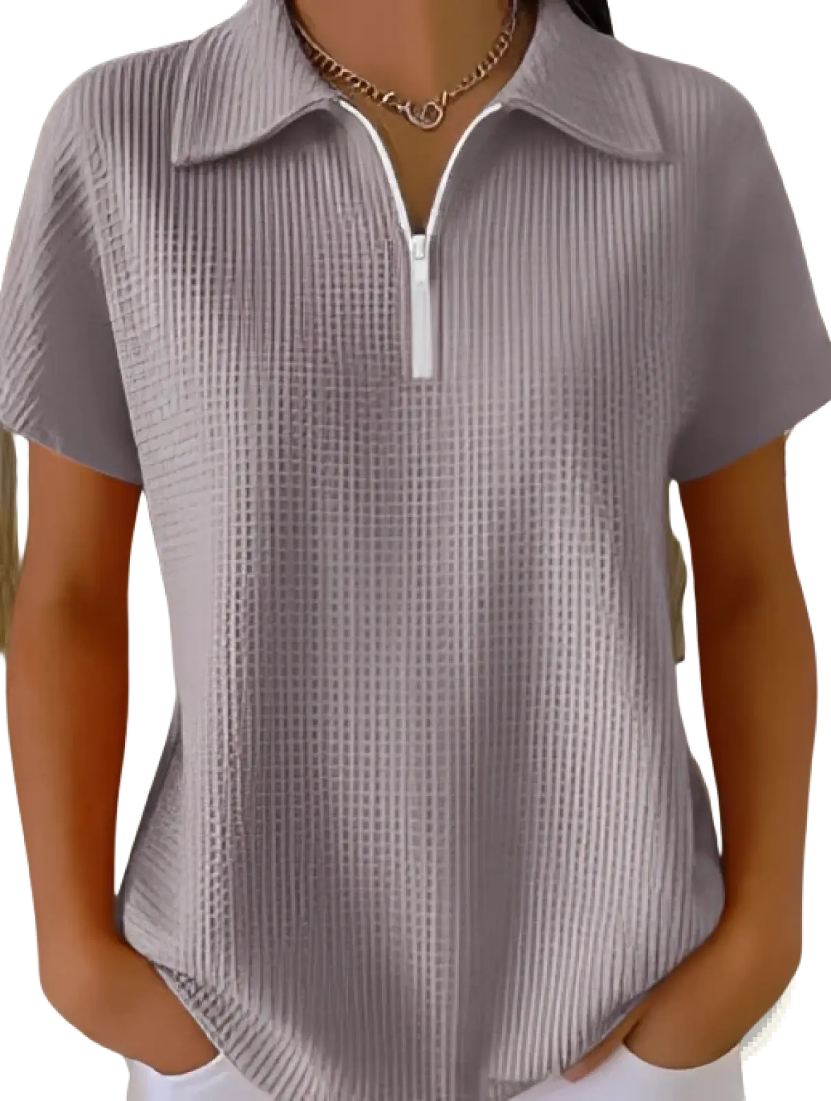 A soft lavender waffle knit half zip short sleeve polo shirt with textured fabric and a white zipper at the collar
