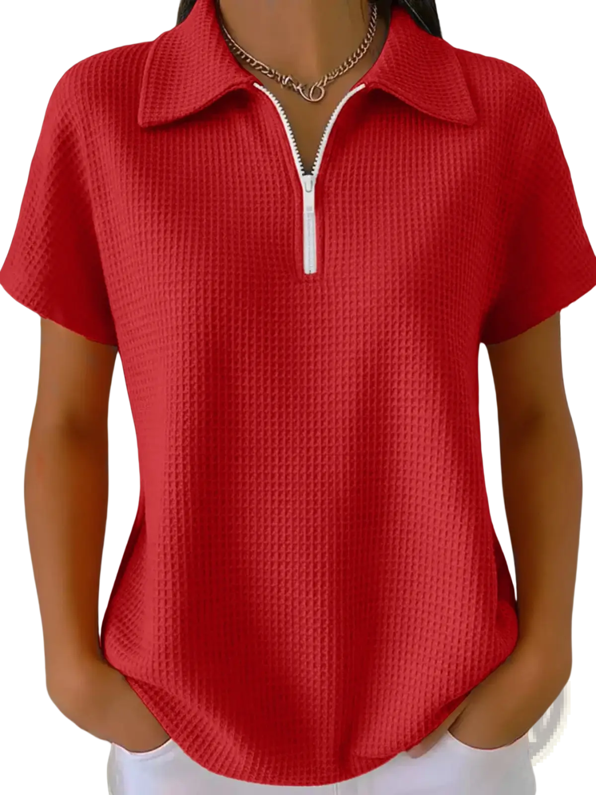 Red waffle knit half zip short sleeve polo shirt with white zipper and collar made from textured fabric