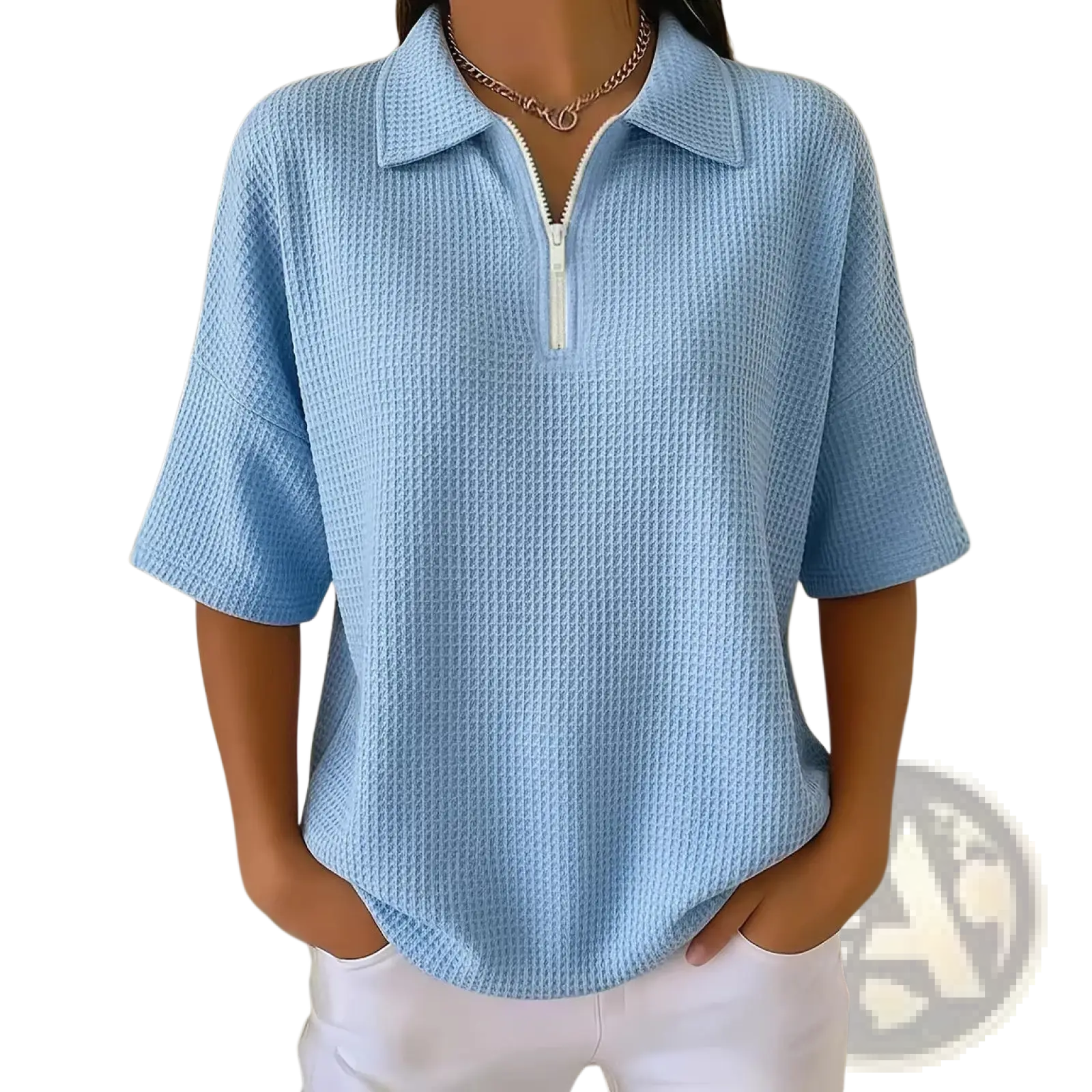 Light blue waffle knit half zip short sleeve polo shirt with white zipper at collar made of textured fabric